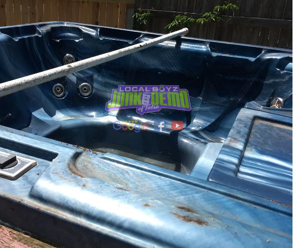 image of an old hot tub that never been used and ready to be hauled off from property